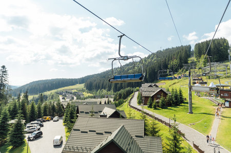 View from the lift to the Carpathian mountains. Tourists move looking at the landscapesの写真素材