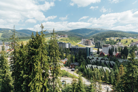 A review view of the resort city in the Carpathian mountains. Roofs of houses and mountains look very atmosphericの写真素材