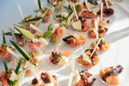 A large selection of food and different snacks in the oncoming zone of guests. A buffet for guestsの写真素材