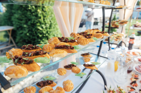 A large selection of food and different snacks in the oncoming zone of guests. A buffet for guestsの写真素材