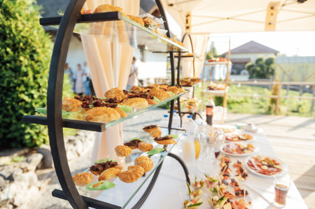 A large selection of food and different snacks in the oncoming zone of guests. A buffet for guestsの写真素材