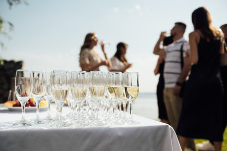 Glasses of champagne at the Banquet, white sparkling wine in wine glasses, festive moodの写真素材