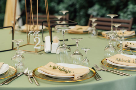 Open air wedding restaurant decorated with fresh flowers and premium dishesの写真素材