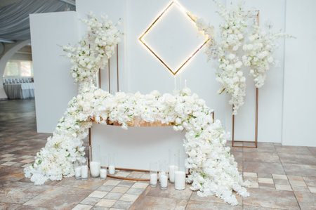 Luxurious restaurant. Luxurious interior, white tables, serving dishes and glasses for guestsの写真素材