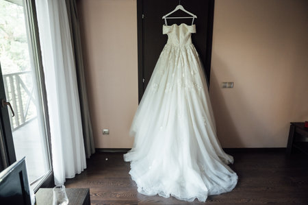 Wedding dress is hanging on the closet. Stylish photoの写真素材