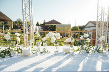 Beautiful flowers decorated on the table. Tables set for an event party or wedding reception.の写真素材