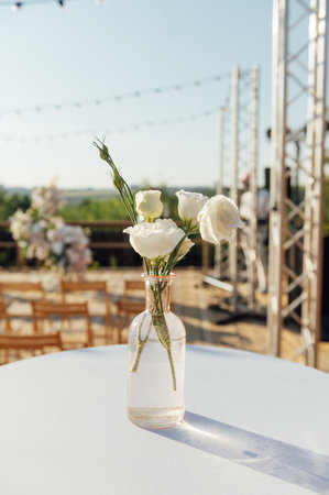 Beautiful flowers decorated on the table. Tables set for an event party or wedding reception.の写真素材