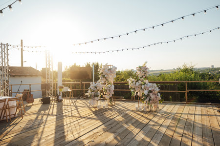 Location for a wedding ceremony on a plank floor. Evening sunset.