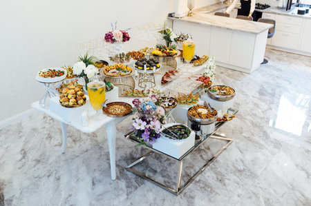 A wide variety of snacks on the table for guests. Shrimp, boiled pork, various types of meat and other productsの写真素材