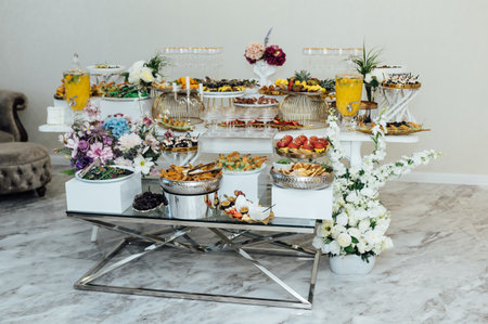 A wide variety of snacks on the table for guests. Shrimp, boiled pork, various types of meat and other productsの写真素材