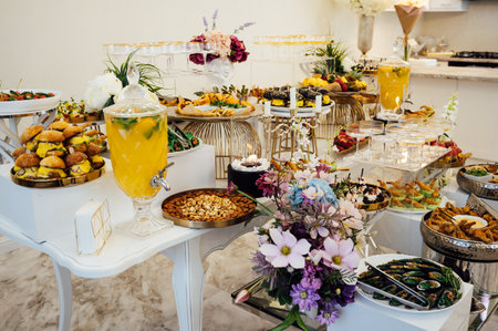 A wide variety of snacks on the table for guests. Shrimp, boiled pork, various types of meat and other productsの写真素材