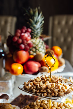 A large variety of fruits and vegetables on the table for guestsの写真素材