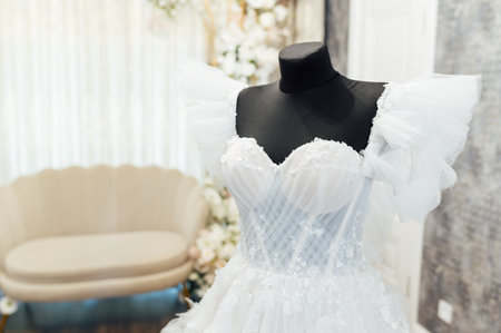White wedding dress on a black dummy before the bride puts it onの写真素材