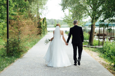 Cute bride couple spend time together after the wedding ceremonyの写真素材