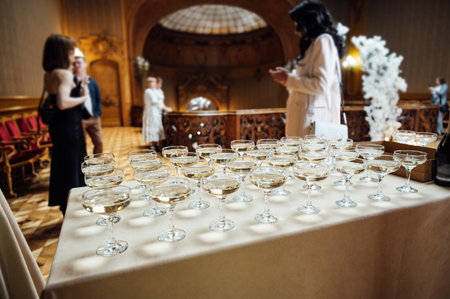 Glasses of champagne at the Banquet, white sparkling wine in wine glasses, festive mood
