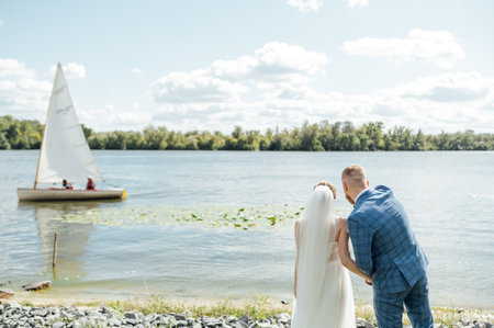 Cute bride couple spend time together after the wedding ceremonyの写真素材