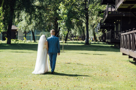 Cute bride couple spend time together after the wedding ceremonyの写真素材