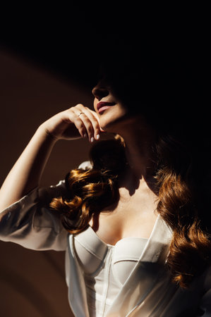 Close portrait of a sexy bride with beautiful breasts in a corset.