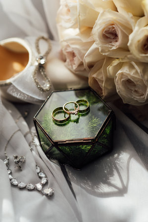 The brides wedding accessory in the form of a bouquet, wedding gold rings and shoes.の写真素材
