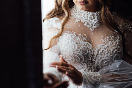 A tender bride strokes her body with her hands and sensually touches her skin. Sensual momentの写真素材