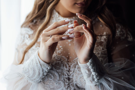 A tender bride strokes her body with her hands and sensually touches her skin. Sensual momentの写真素材