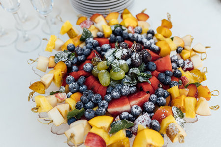 Wedding party. Buffet table with vegetables and fruits.の写真素材