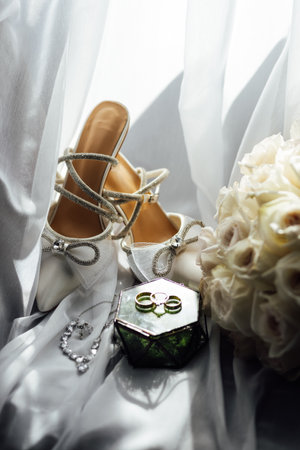 The brides wedding accessory in the form of a bouquet, wedding gold rings and shoes.の写真素材