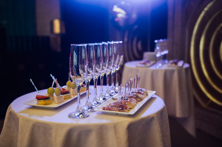 Appetizer Plate. An area for welcoming guests with food and empty champagne glassesの写真素材