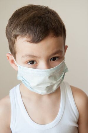 Portrait of a boy in the medical maskの写真素材