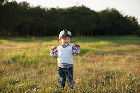 boy captain sailor spring forest funny smile joy laughter kidの写真素材