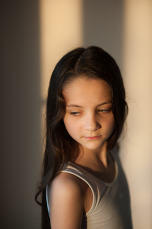 Portrait of handsome little girl looking downの写真素材