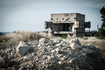 ruins of building construction in war conflict or natural disaster zone with copyspaceの写真素材