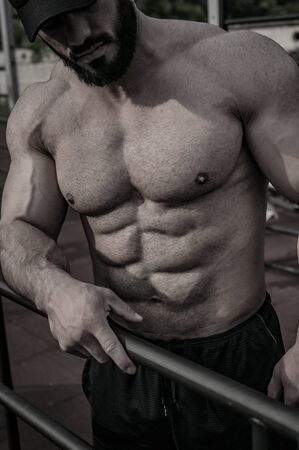 strong young man athlete with beard with perfect sport healthy bodyの写真素材