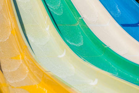 multicolored water slides in amusement aqua park outdoors sunny summer leisure dayの写真素材