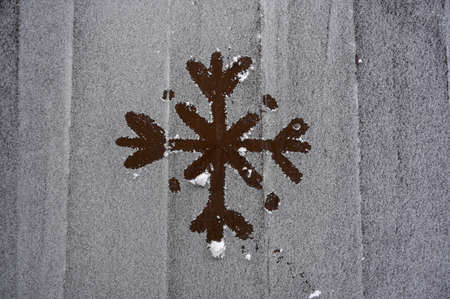drawing snowflake on wooden frozen table in winter season christmas eveの写真素材