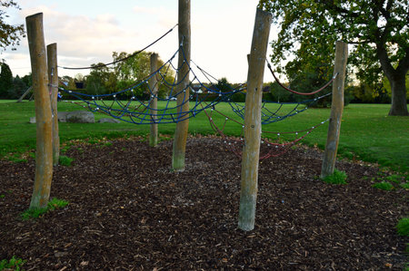 Childrens climbing playground with rope nets and wooden postsの写真素材