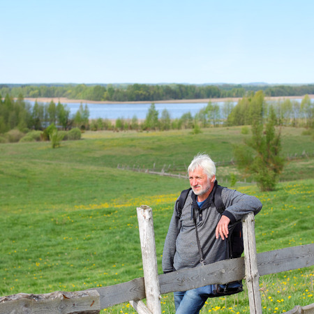 Elderly travel photographer on the natureの写真素材