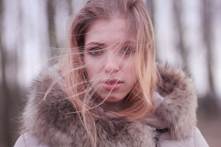 winter portrait of a beautiful blondeの写真素材