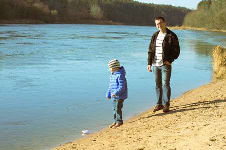 young family near the water let paper craftsの写真素材