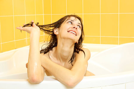 Beautiful portrait of pretty girl in the bath