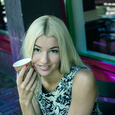 beautiful young girl resting in a cafeの写真素材