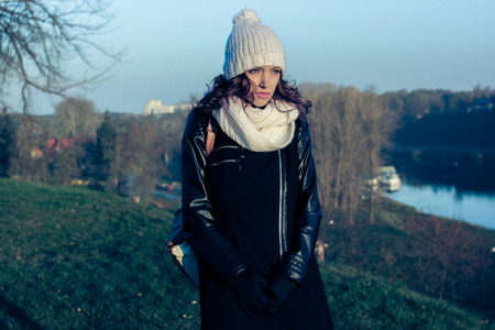 The sad hipster girl with autumn depression. Outdoor lifestyle portrait. 