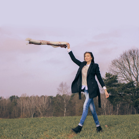 beautiful girl walks into the field. portrait of a beautiful young girlの写真素材