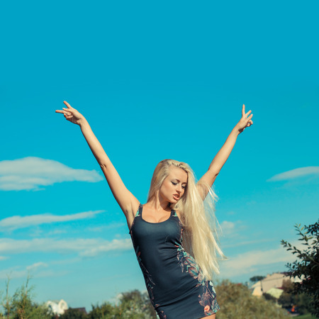 Portrait of emotional blonde bright outdoors. Woman enjoys life.の写真素材
