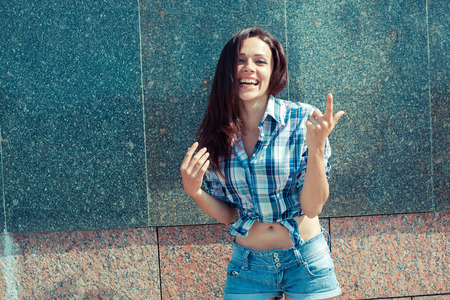 Positive hipster girl. Portrait of a pretty hipster girlの写真素材