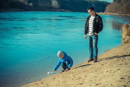 Beautiful young family admits paper craftsの写真素材