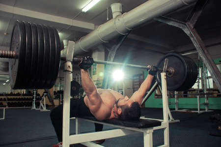 brutal man is engaged in the gym.の写真素材