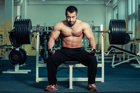 brutal man is engaged in the gym.の写真素材