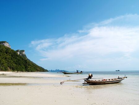 A small boat on an island of angthong national park, Thailandの写真素材