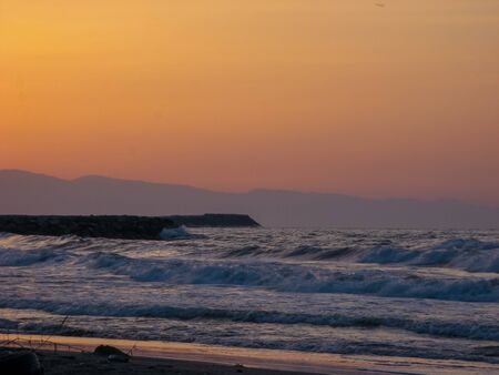 Sunset sky abstract background. Yellow sunset sky over the sea. Golden time of sky at sunset -...